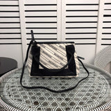 Side profile of refined chic women's handbag – women's luxury handbag