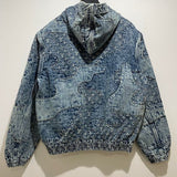 Side profile of Louis Vuitton luxury clothing with signature branding