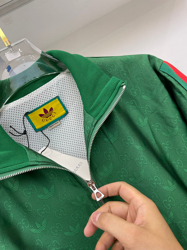 Flat lay presentation of Gucci luxury clothing with label-forward styling