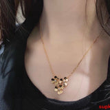 Lifestyle view of Van Cleef & Arpels unisex jewelry piece