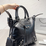 Ziva's Charm handbag – side angle view (one versatile size)