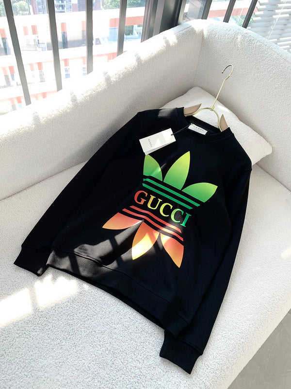 Flat lay presentation of Gucci luxury clothing with logo-detail design