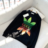 Flat lay presentation of Gucci luxury clothing with logo-detail design