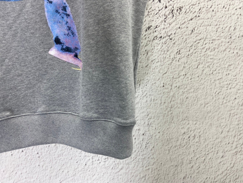 Close-up detail shot of Louis Vuitton luxury clothing with logo-detail design