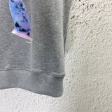 Close-up detail shot of Louis Vuitton luxury clothing with logo-detail design