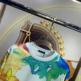 Full styled look of Louis Vuitton luxury clothing with signature branding