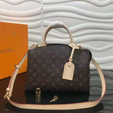 Side profile of signature structured women's handbag – women's designer-style accessory