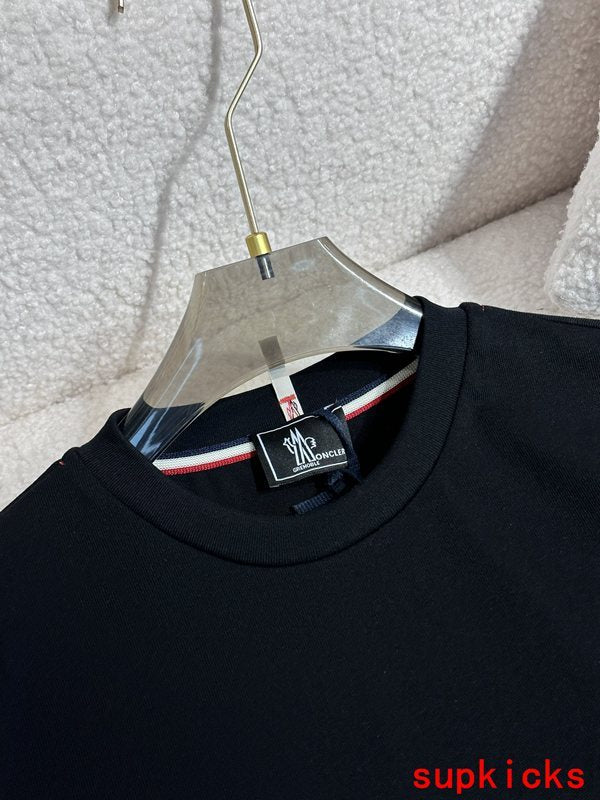 Close-up detail shot of Moncler luxury clothing with monogram-inspired silhouette