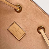 Side profile of modern structured women's handbag – women's luxury accessory