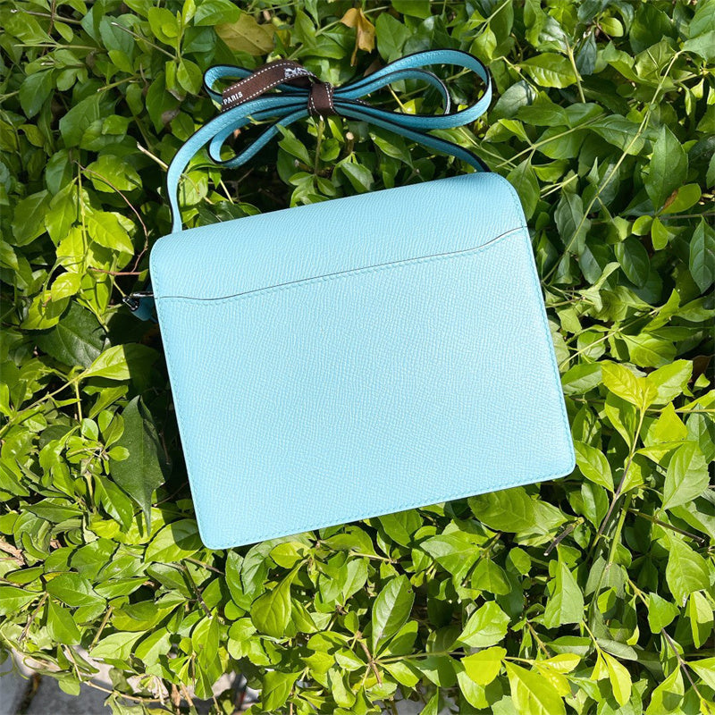 Side view of poised structured handbag