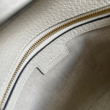 Side profile of chic polished women's handbag – women's statement bag