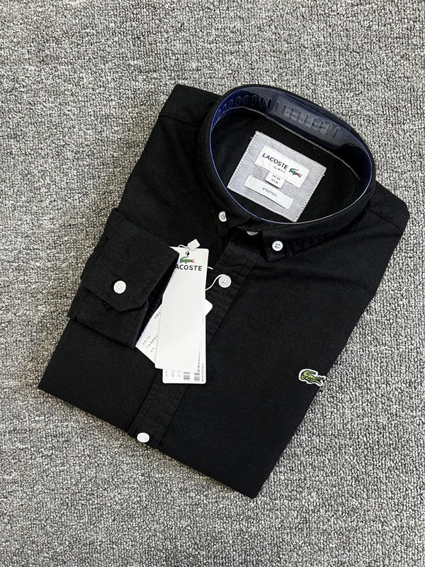 Flat lay presentation of Lacoste luxury clothing with logo-detail design