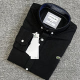 Flat lay presentation of Lacoste luxury clothing with logo-detail design