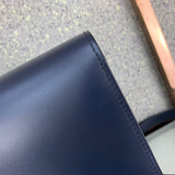 Side profile of sleek elevated women's handbag – women's luxury handbag