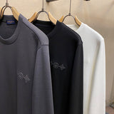 Close-up detail shot of Louis Vuitton luxury clothing with runway-inspired design