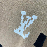 Flat lay presentation of Louis Vuitton luxury clothing with logo-detail design