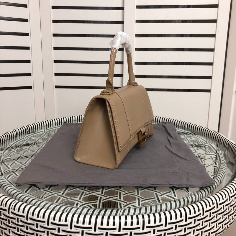 Styled lifestyle shot of modern statement women's handbag – women's luxury handbag