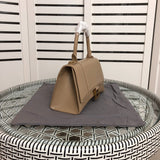 Styled lifestyle shot of modern statement women's handbag – women's luxury handbag