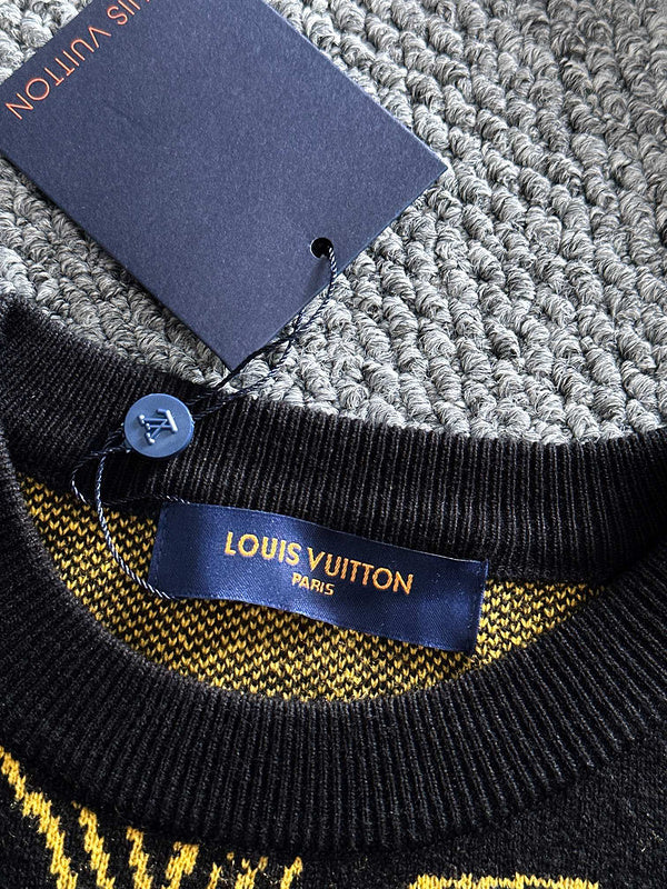Back view of Louis Vuitton luxury clothing with label-forward styling