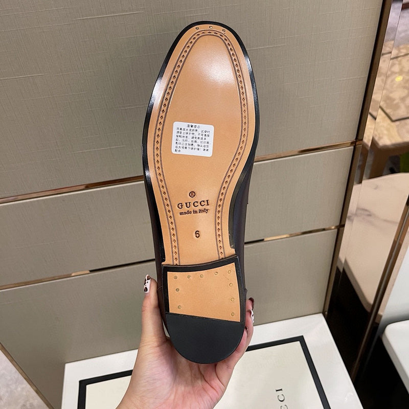 Side profile of Gucci two-tone sneakers signature lace-up style