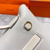 Side view of poised structured handbag