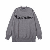 Full styled look of Louis Vuitton luxury clothing with label-forward styling