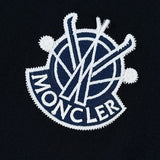 Full styled look of Moncler luxury clothing with signature branding