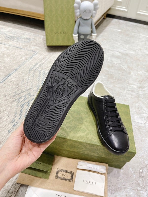 Side profile of Gucci classic monochrome sneakers everyday casual design
