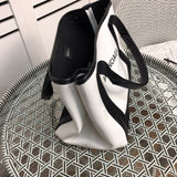 Back view of everyday-luxe statement women's handbag – women's luxury accessory