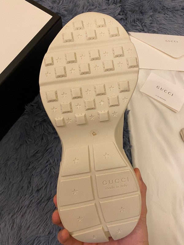 Side profile of Gucci soft grey sneakers bold athletic profile