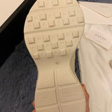 Side profile of Gucci soft grey sneakers bold athletic profile