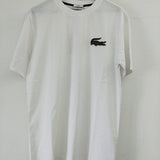 Flat lay presentation of Lacoste luxury clothing with signature branding