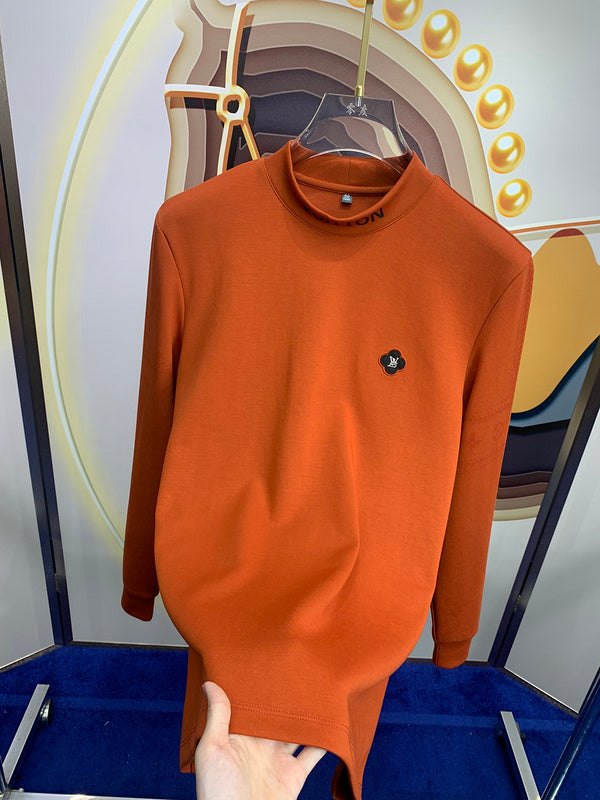 Flat lay presentation of Louis Vuitton luxury clothing with monogram-inspired silhouette