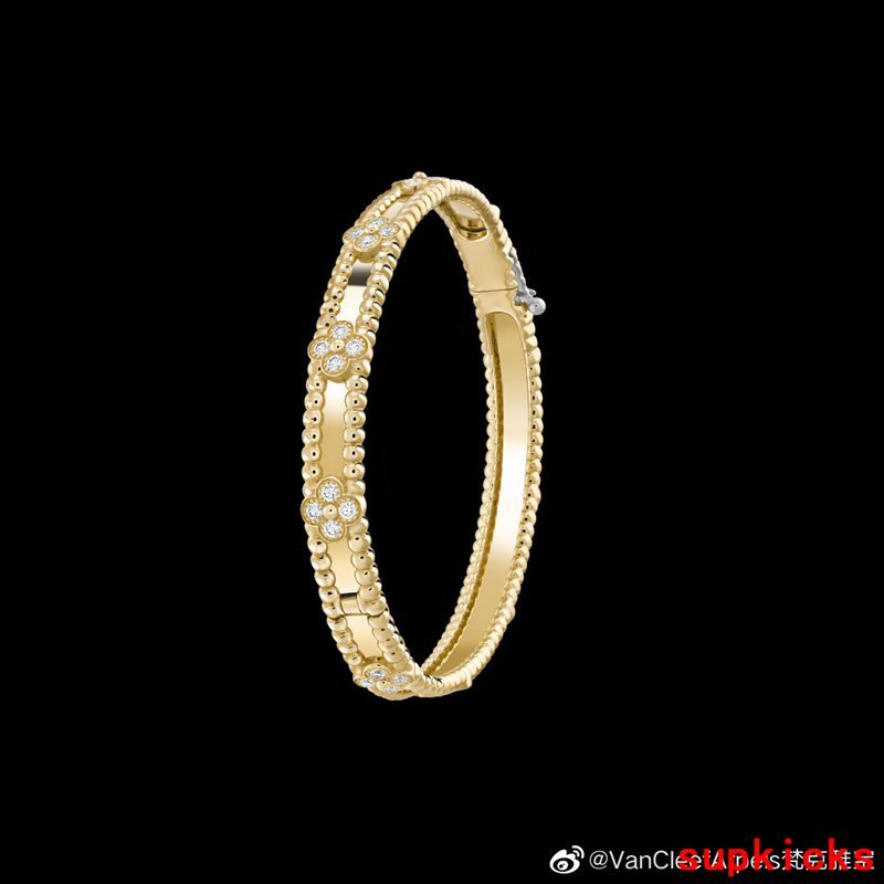 Lifestyle view of Van Cleef & Arpels unisex jewelry piece