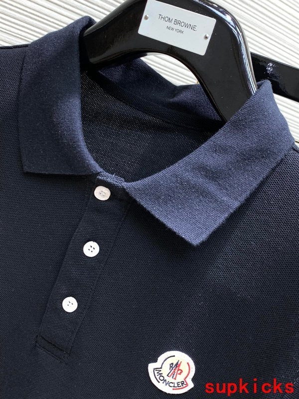 Close-up detail shot of Moncler luxury clothing with signature branding