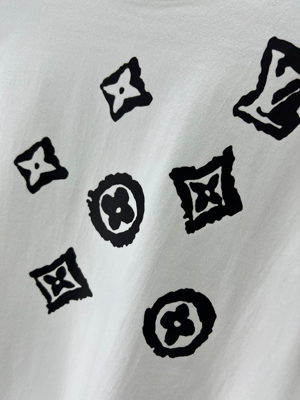 Flat lay presentation of Louis Vuitton luxury clothing with monogram-inspired silhouette