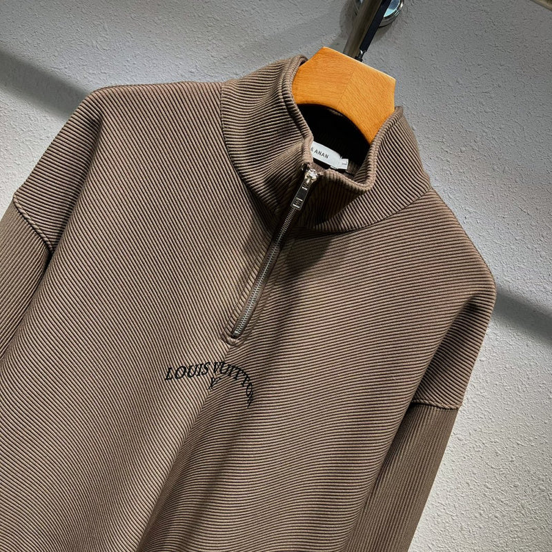 Close-up detail shot of Louis Vuitton luxury clothing with monogram-inspired silhouette