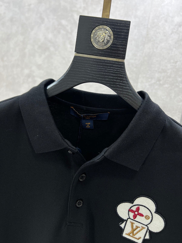 Close-up detail shot of Louis Vuitton luxury clothing with label-forward styling