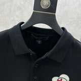 Close-up detail shot of Louis Vuitton luxury clothing with label-forward styling