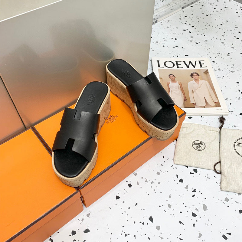 Hermès Tan Flat Thong Sandals - Angled View