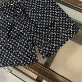 Close-up detail shot of Louis Vuitton cotton t-shirt with runway-inspired design