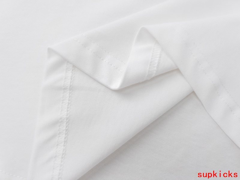 Close-up detail shot of Moncler luxury clothing with logo-detail design