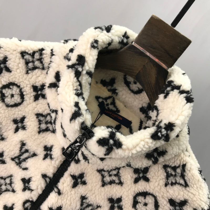Close-up detail shot of Louis Vuitton luxury clothing with logo-detail design