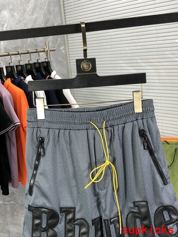Close-up detail shot of Rhude luxury clothing with monogram-inspired silhouette