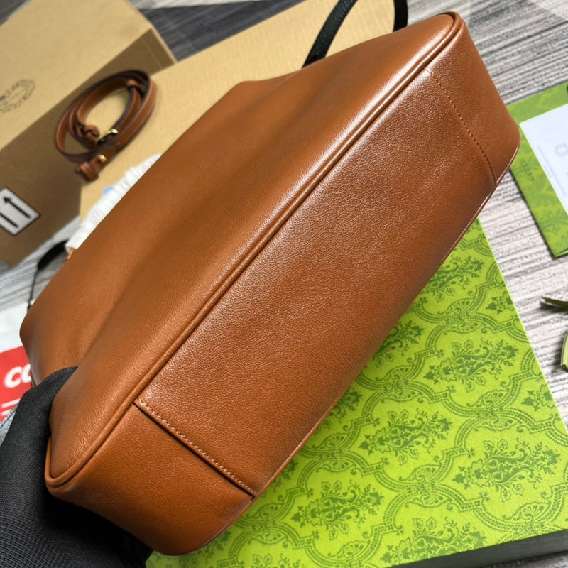 Styled lifestyle shot of structured everyday-luxe women's handbag – women's luxury accessory