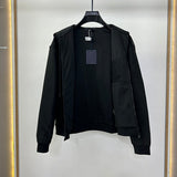 Side profile of Louis Vuitton luxury clothing with label-forward styling
