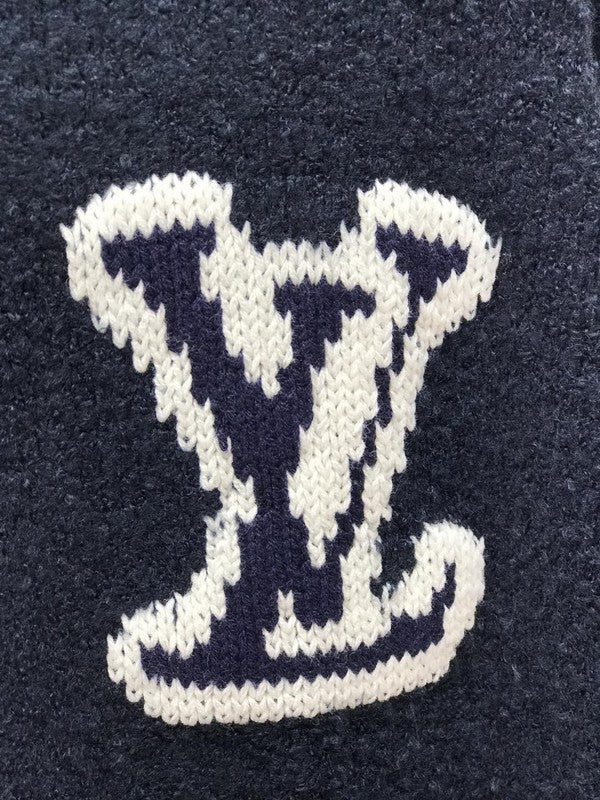 Full styled look of Louis Vuitton luxury clothing with label-forward styling