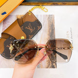 Front view of Louis Vuitton unisex sunglasses