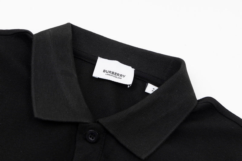Close-up detail shot of Polo cotton polo shirt with monogram-inspired silhouette
