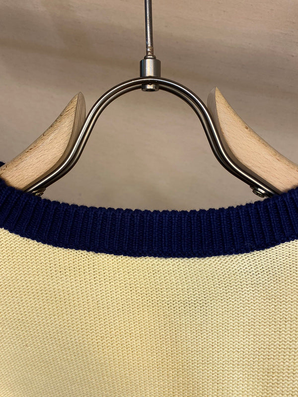 Close-up detail shot of Gucci luxury clothing with label-forward styling